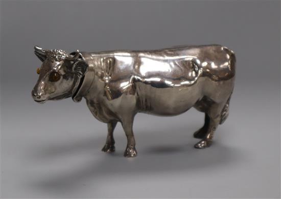 A Continental silver model of a standing cow L 9cm